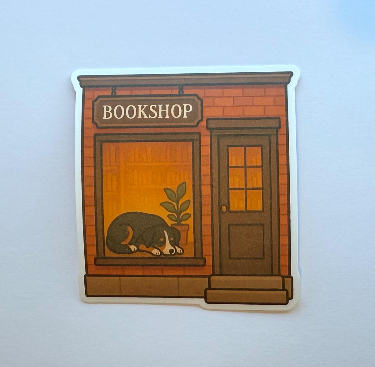 Dog in a Bookshop Window Sticker